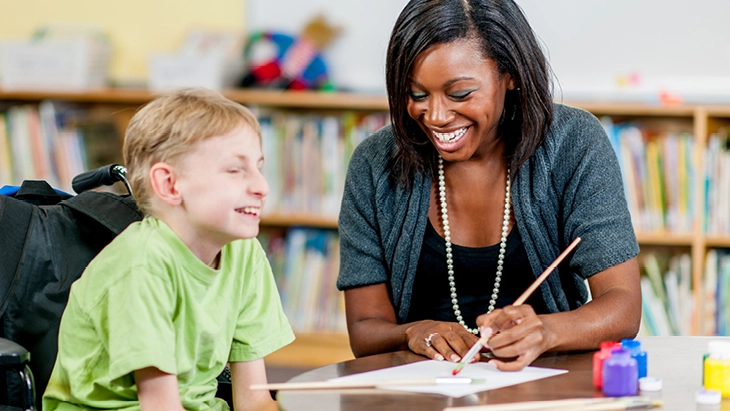 Woman in social care helping child